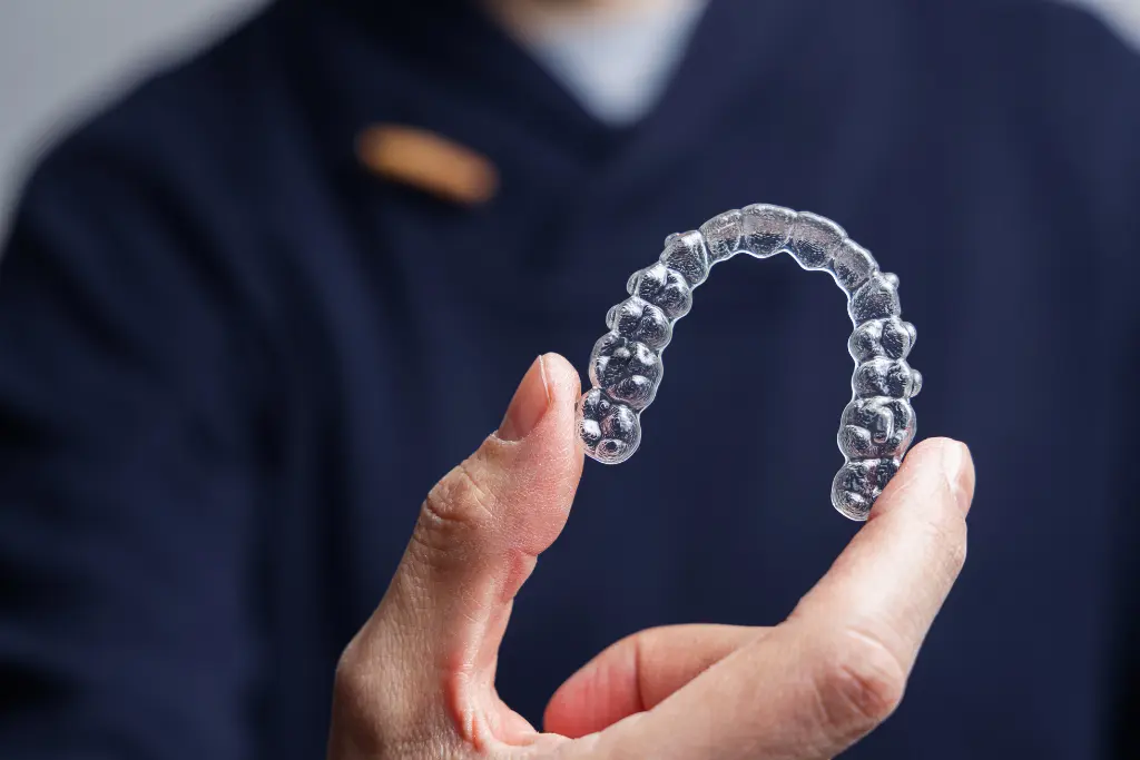 Dr Iyer Holding Invisalign Clear Aligner Tray