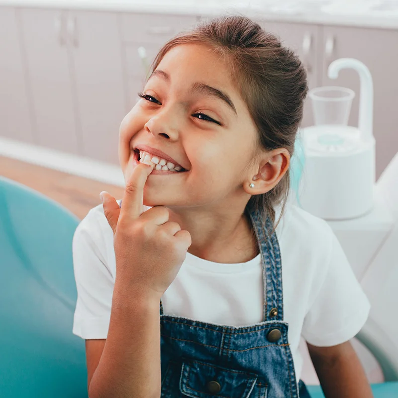 Child Smiling Showing Dental Bonding
